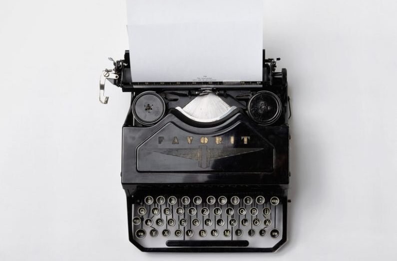 black Fayorit typewriter with printer paper
